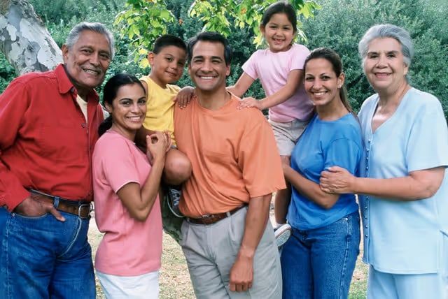 A smiling family of three generations